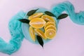 Sliced Ã¢â¬â¹Ã¢â¬â¹lemons on a blue plate on a white background. Flat lei. Royalty Free Stock Photo